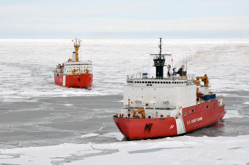 Two icebreaker ships with open water and floating ice