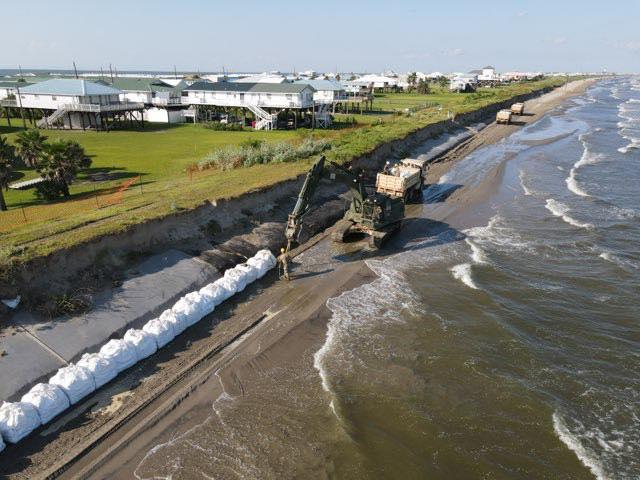 Equipment and large bags along coast