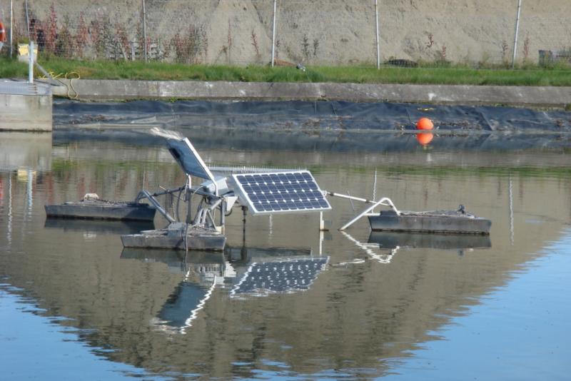 Solar panels mounted above wastewater pool