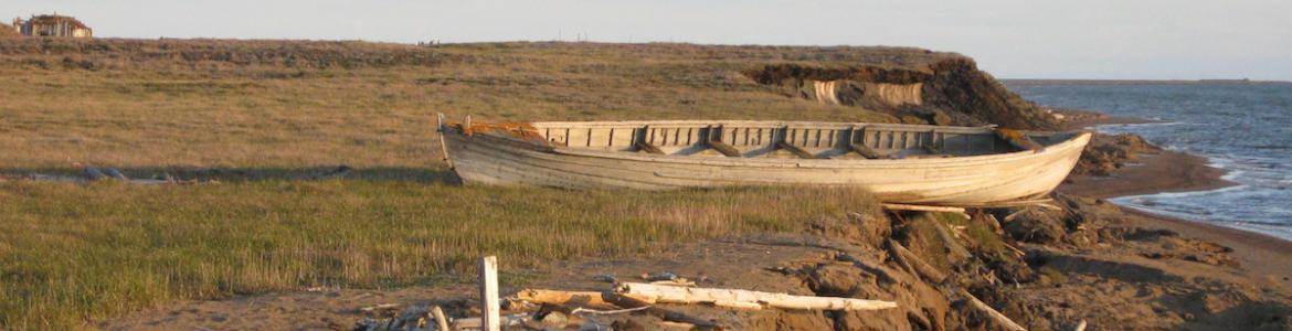 Canoe on eroding coastal bluff